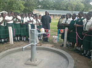 Father of St Philips catholic church giving his speach during hand over ceremony_web
