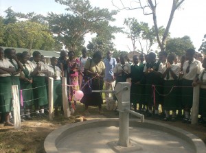 One of the BWP officials oppening the well officially during handingover ceremony at st.Philips Girls sec.school._web