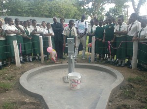 St Philips Girls School student testing the handpump scheme during handover ceremony_web