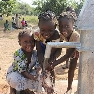 Girls collecting water in Burkina Faso