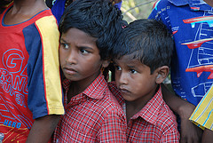Boys look on as new well is opened