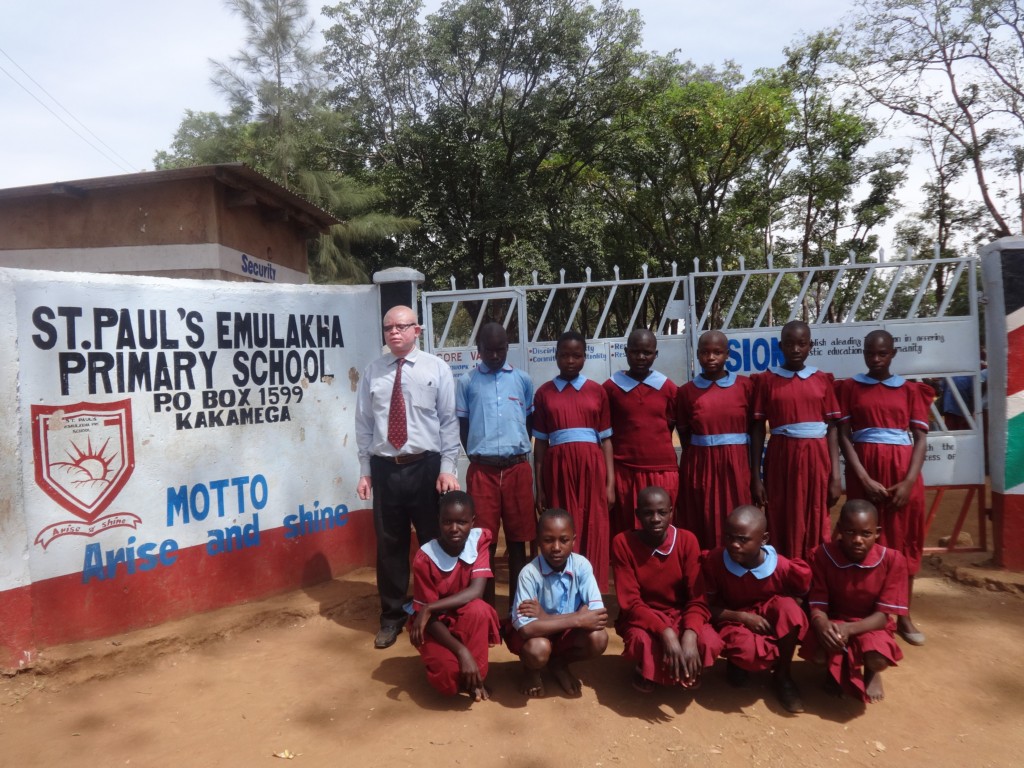 The Water Project : 2-kenya4678-headteacher-poses-with-students-at-school-gate