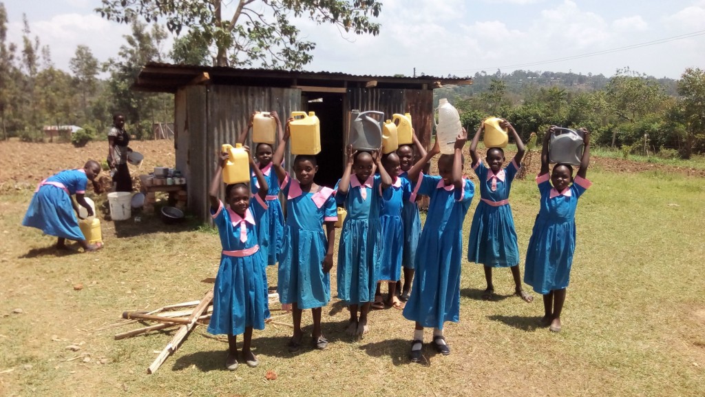 The Water Project : 8-kenya4695-girls-posing-with-jerrycans