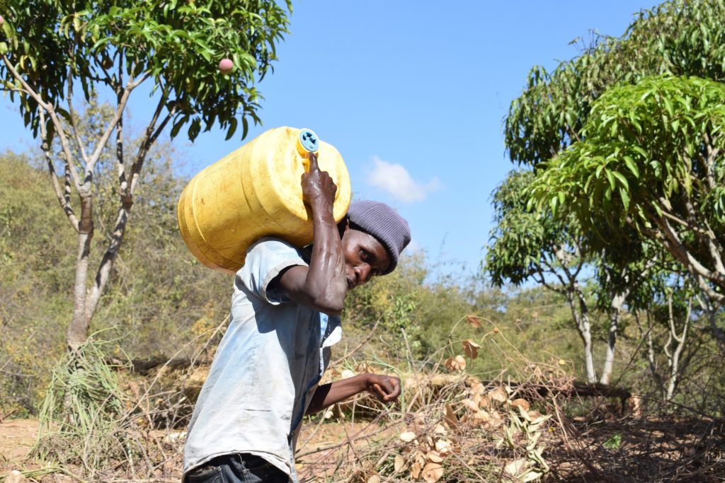 The Water Project : kenya18213-hauling-water-home
