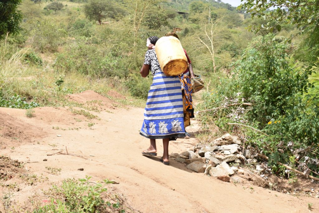 The Water Project : kenya18228-carrying-water-home