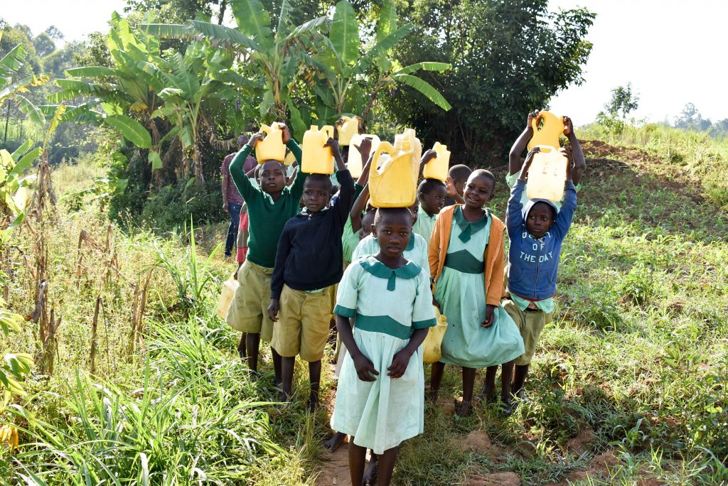 The Water Project : 5-kenya18310-carrying-water-back-to-school