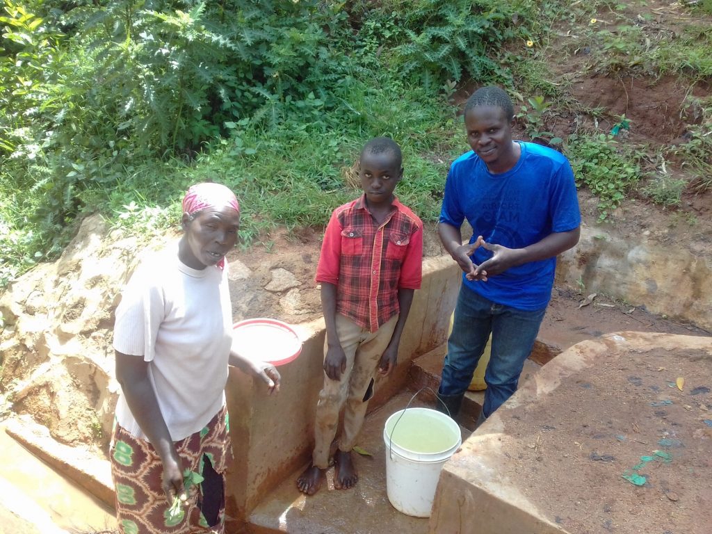 The Water Project : kenya4852-margaret-lihanda-derick-maraha-and-field-officer-samuel-simidi