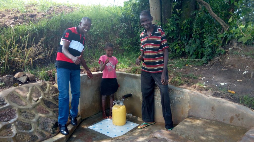 The Water Project : kenya4857-field-officer-jonathan-mutai-mercy-simwa-and-simion-simwa