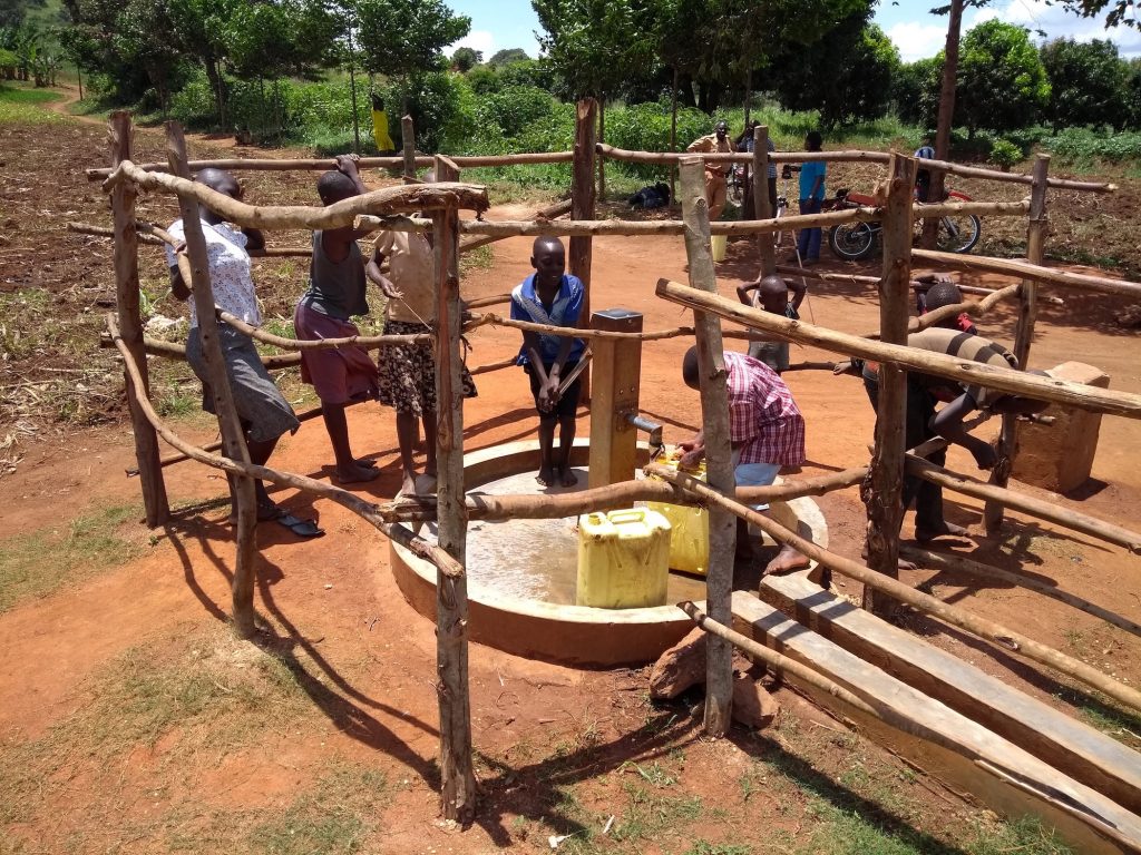 The Water Project : uganda6082-community-members-using-the-water-point