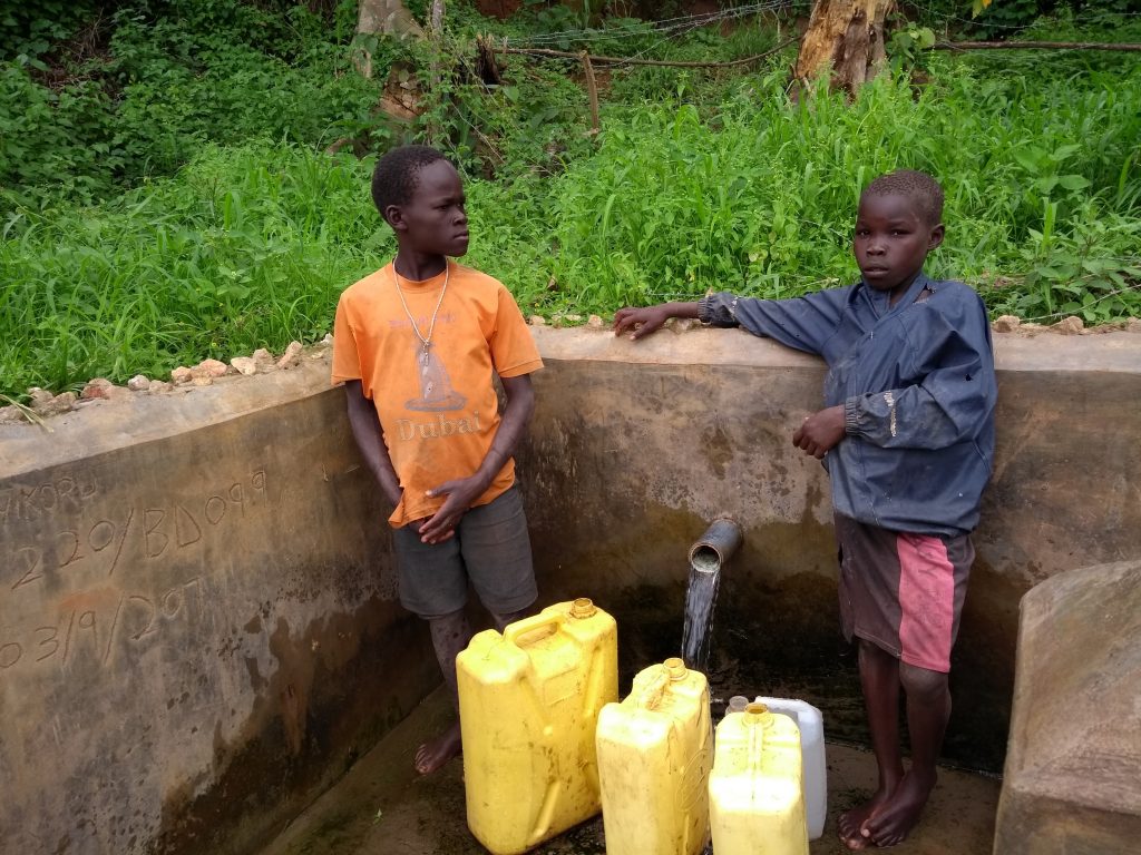 The Water Project : uganda6086-boys-collect-water-from-the-spring