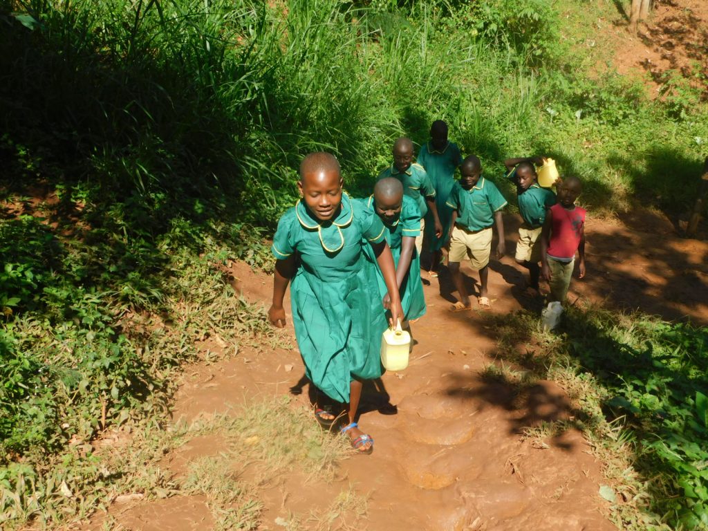 The Water Project : 9-kenya19175-carrying-water-to-school