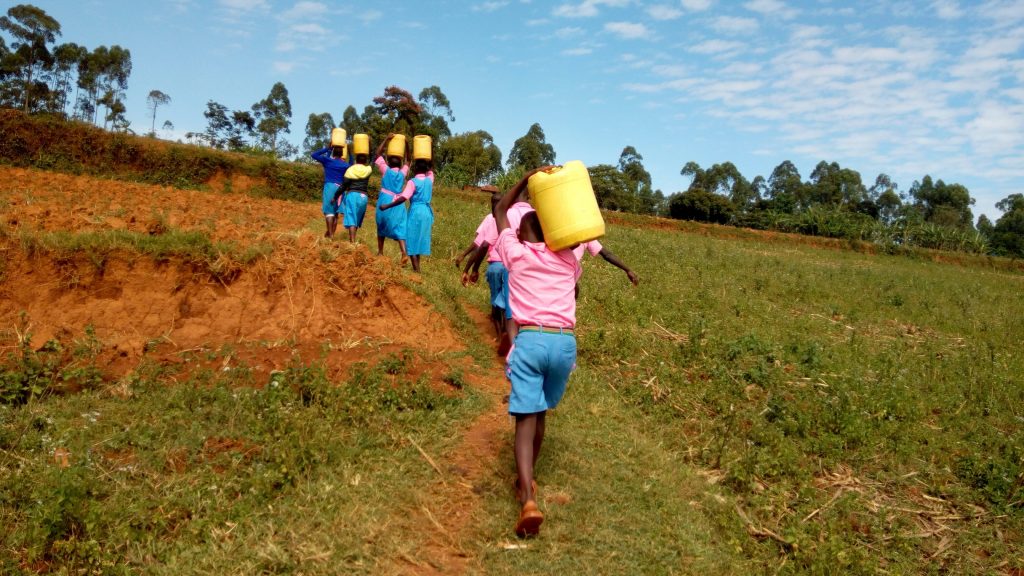The Water Project : 8-kenya19046-carrying-water-back-to-school