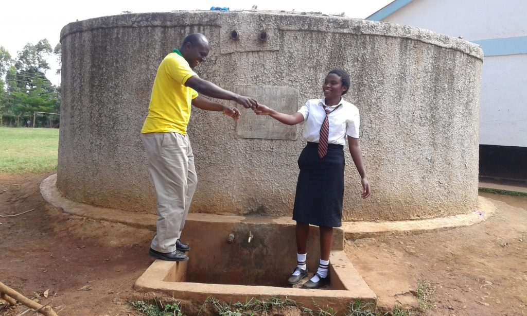 The Water Project : 2-kenya18028-deputy-head-teacher-jason-asenga-with-student