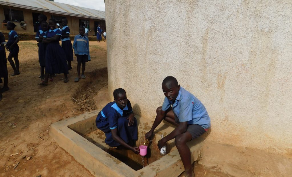 The Water Project : 3-kenya18043-students-get-a-drink-from-the-rain-tank