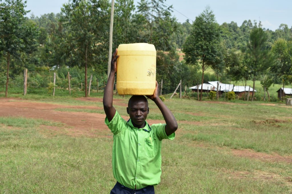 The Water Project : 20-kenya20002-student-carrying-water-2