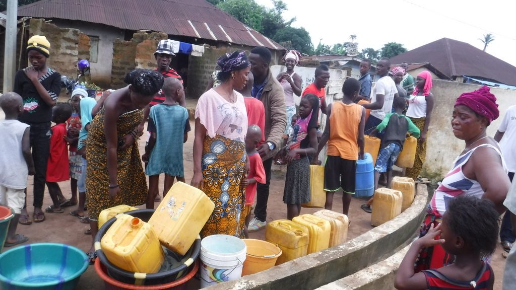 The Water Project : sierraleone18279-community-members-using-water-source