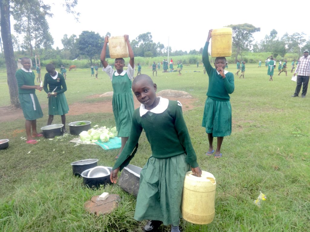 The Water Project : 29-kenya20127-students-deliver-water-to-the-kitchen