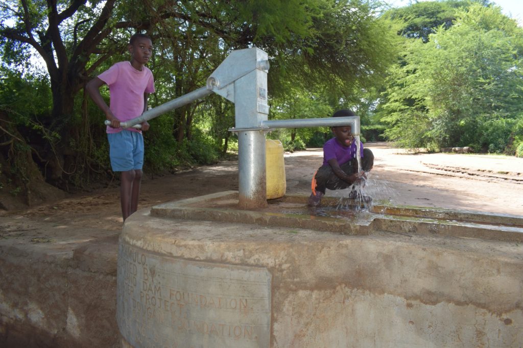The Water Project : kenya19223-pumping-the-well