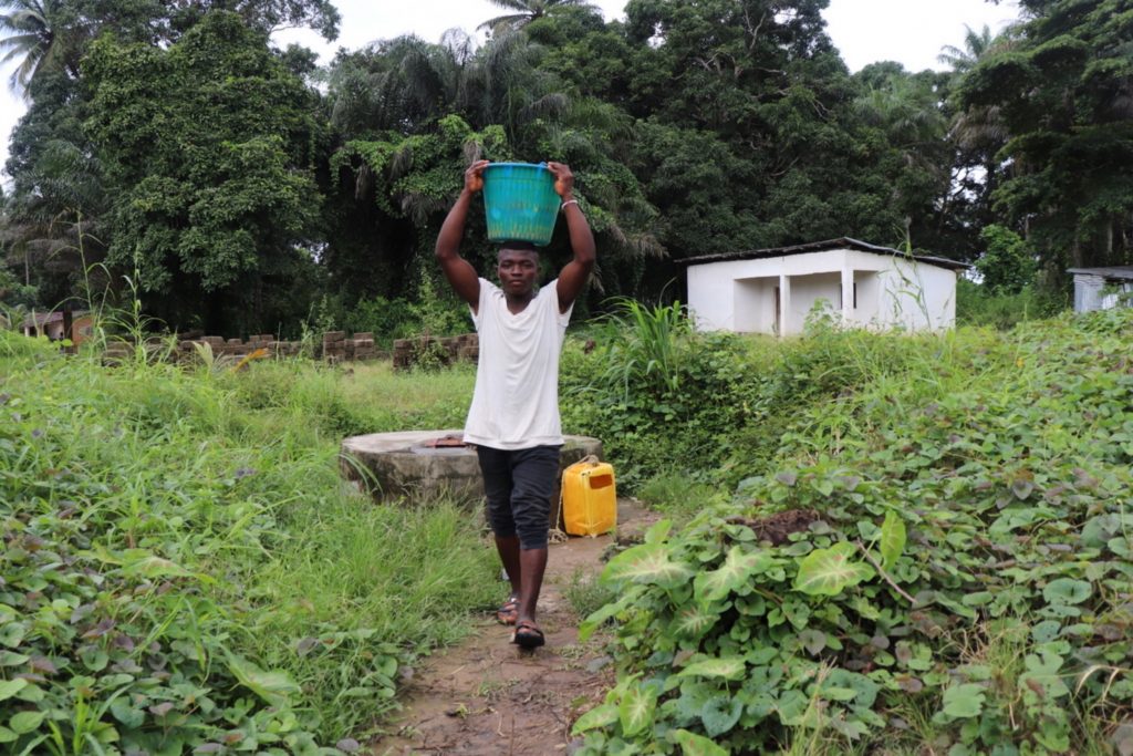 The Water Project : sierraleone20402-young-boy-carrying-water