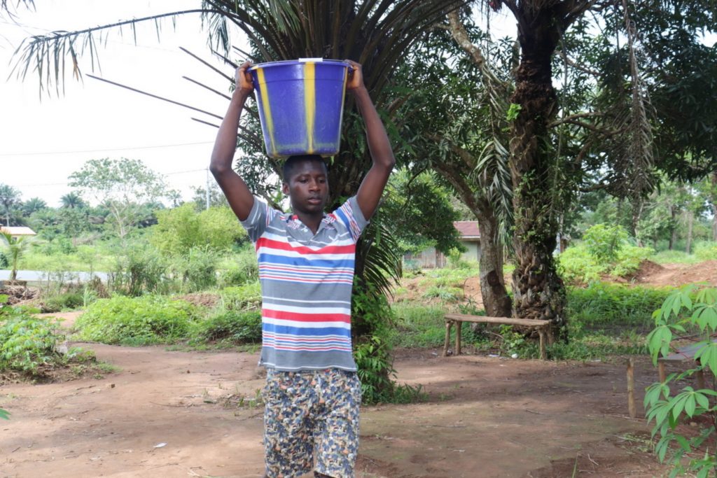 The Water Project : sierraleone20403-boy-carrying-water-1