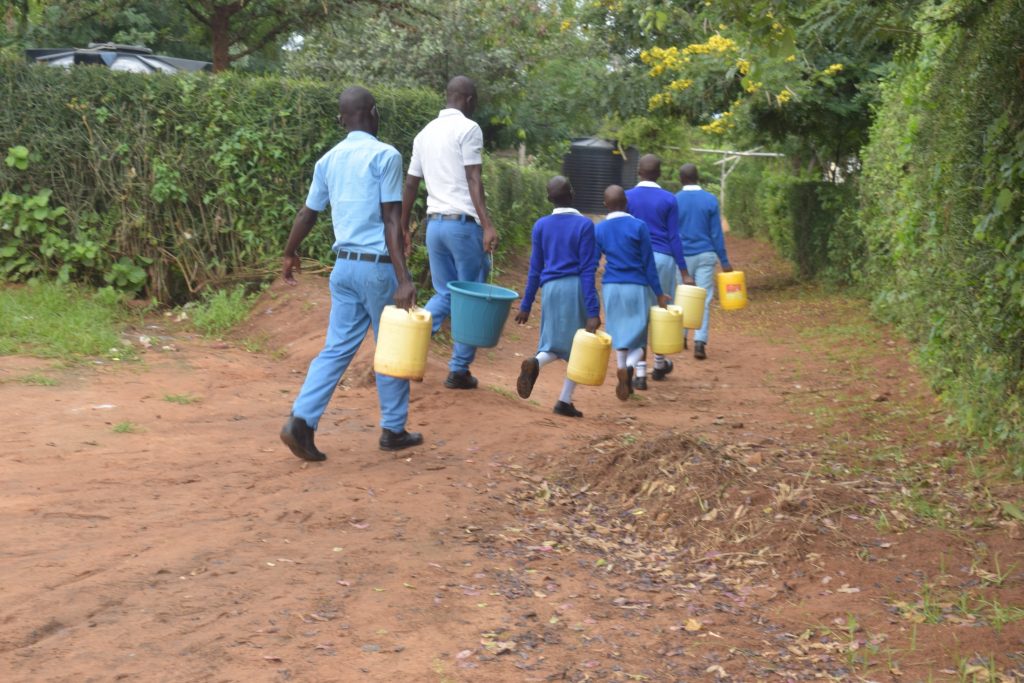 The Water Project : kenya20352-students-carrying-water