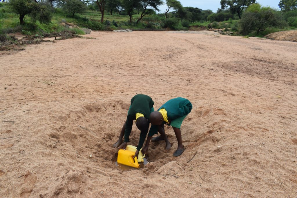 The Water Project : kenya20355-students-at-the-scoop-hole