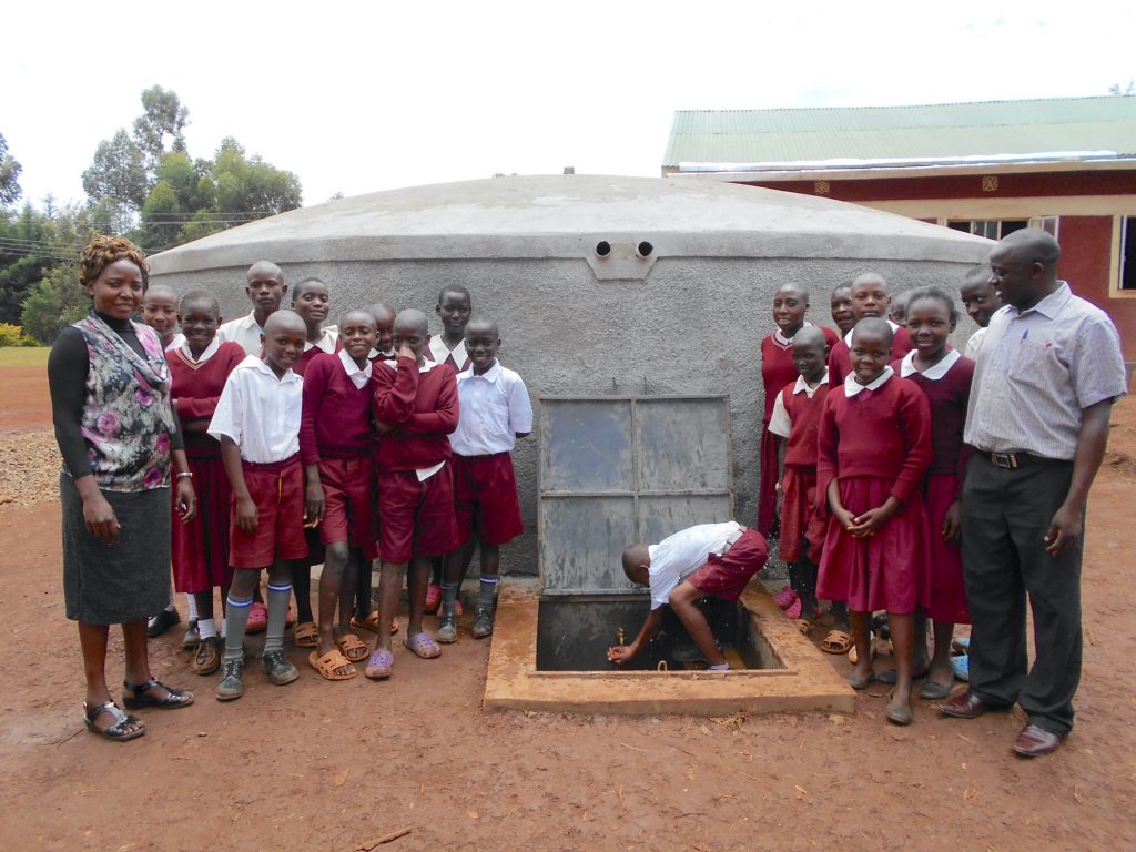 The Water Project : 44-kenya19062-students-and-teachers-pose-with-the-rain-tank