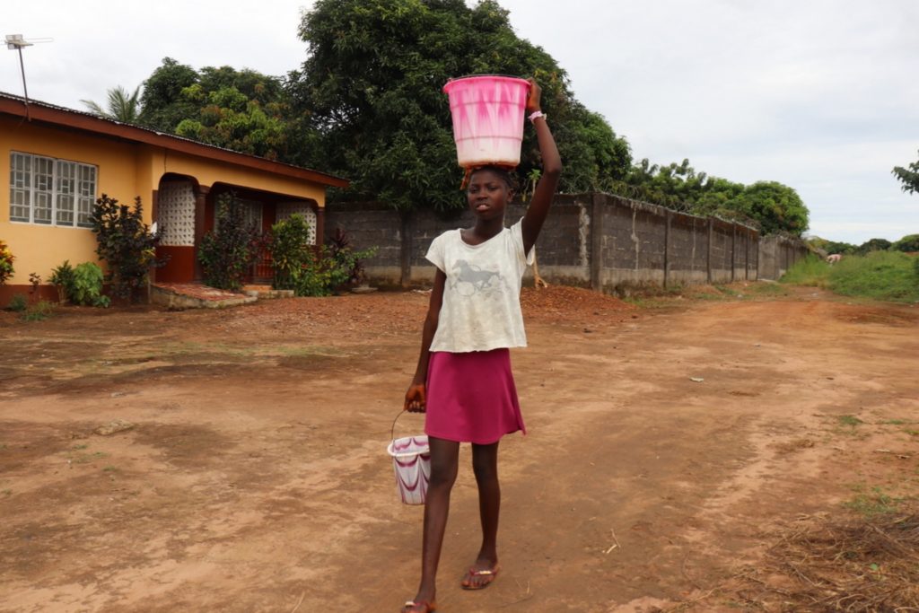 The Water Project : sierraleone20407-young-carrying-water-2