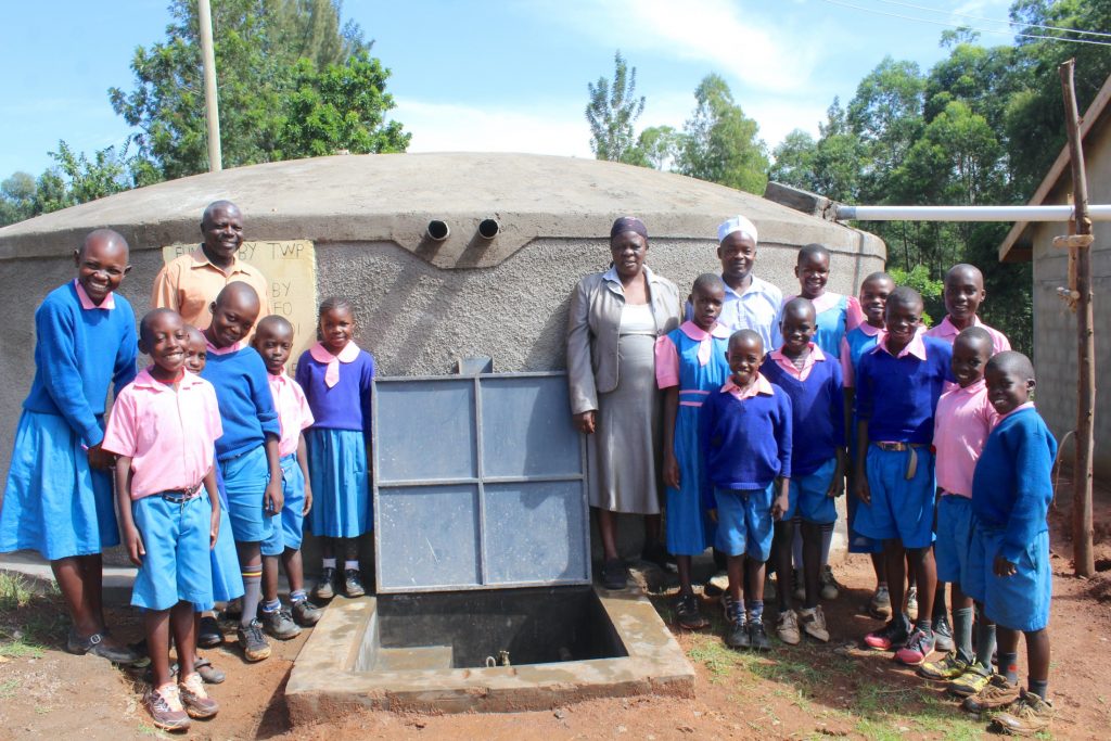 The Water Project : 36-kenya20115-pupils-teachers-and-staff-pose-at-rain-tank-7