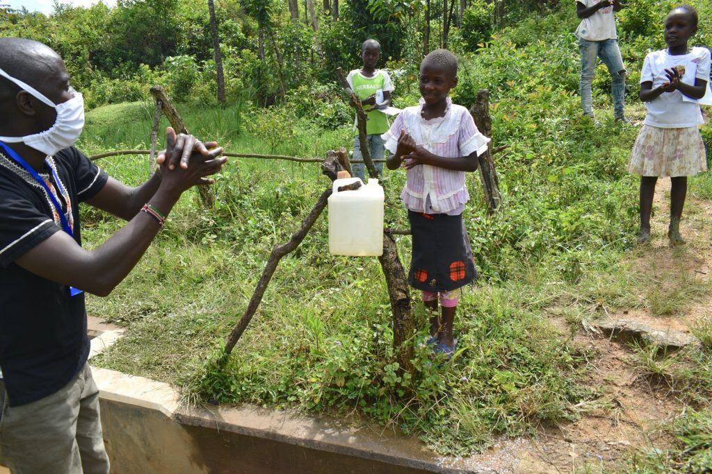 The Water Project : 9-kenya19099-trainer-erick-demonstrating-handwashing