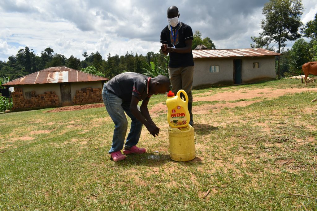 The Water Project : covid19-kenya18149-the-facilitator-leading-the-handwashing-exercise