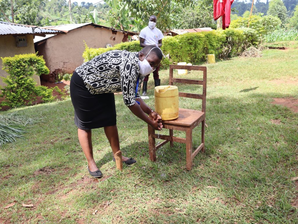 The Water Project : covid19-kenya4582-rinse-your-hands-in-clean-running-water