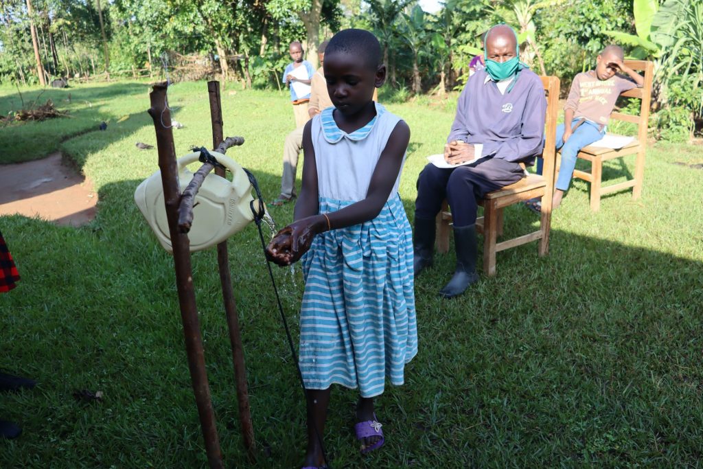 The Water Project : covid19-kenya4748-using-a-hands-free-station