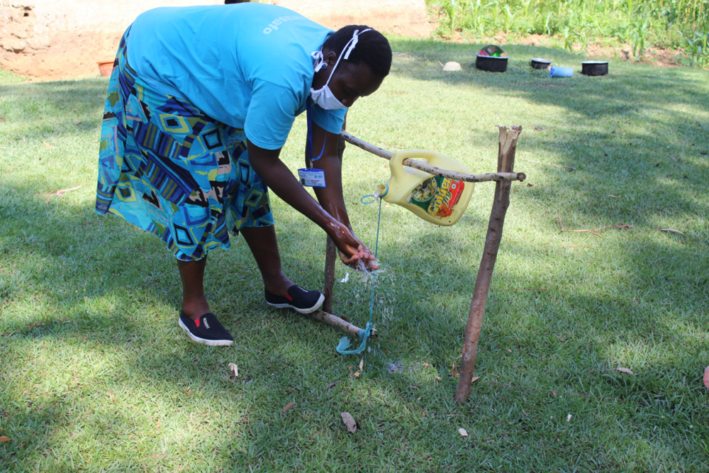 The Water Project : covid19-kenya19117-handwashing-using-the-installed-handwashing-point