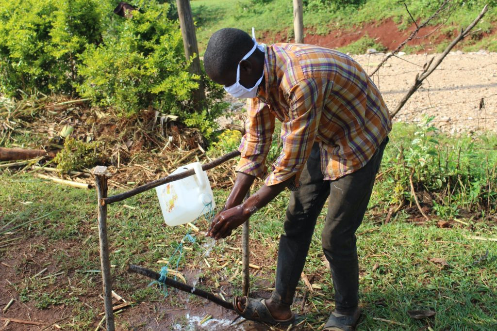 The Water Project : covid19-kenya4745-rinse-your-hands-in-clean-running-water