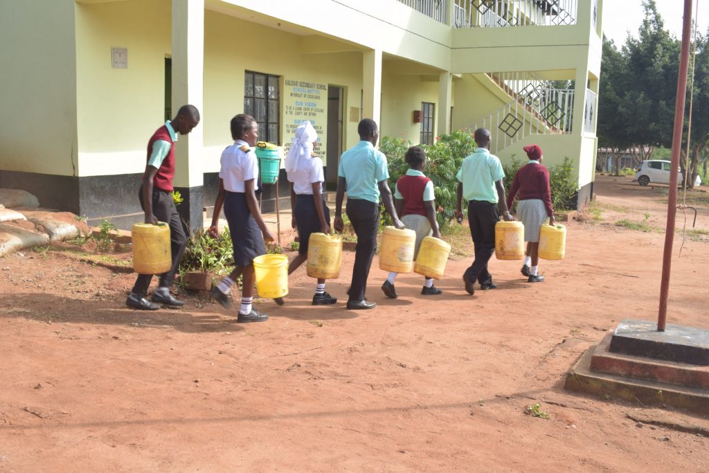 The Water Project : kenya20366-students-carrying-water-1