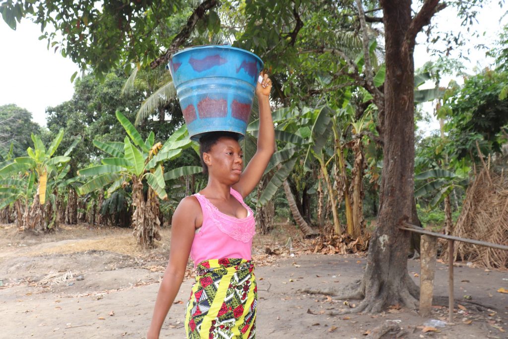 The Water Project : sierraleone20437-woman-carrying-water-2
