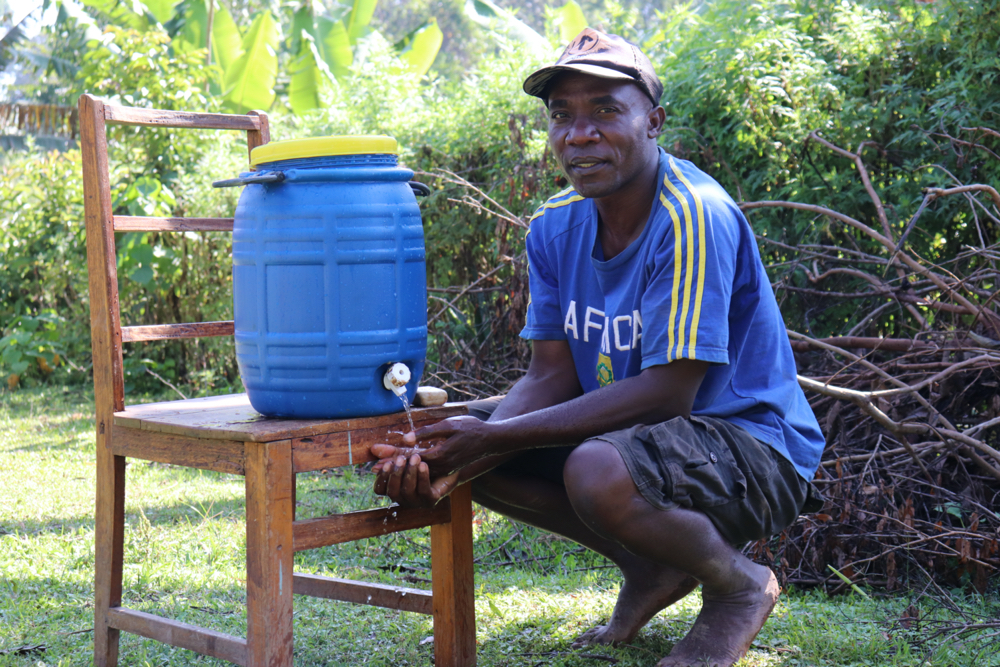 The Water Project : covid19-kenya19087-david-washing-his-hands