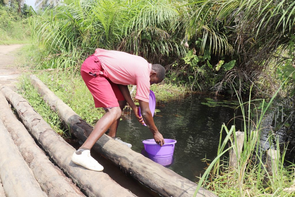 The Water Project : sierraleone21525-student-collecting-water-at-alternate-water-source