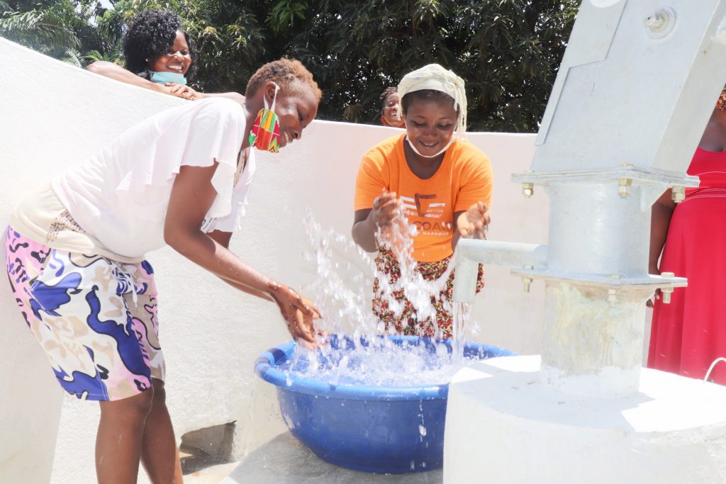 The Water Project : sierraleone20431-women-celebrating-and-splashing-water