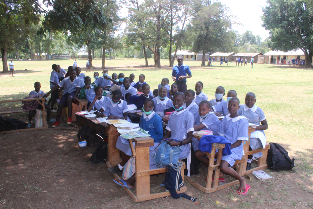 The Water Project : kenya21358-students-attend-class-in-the-shade-1