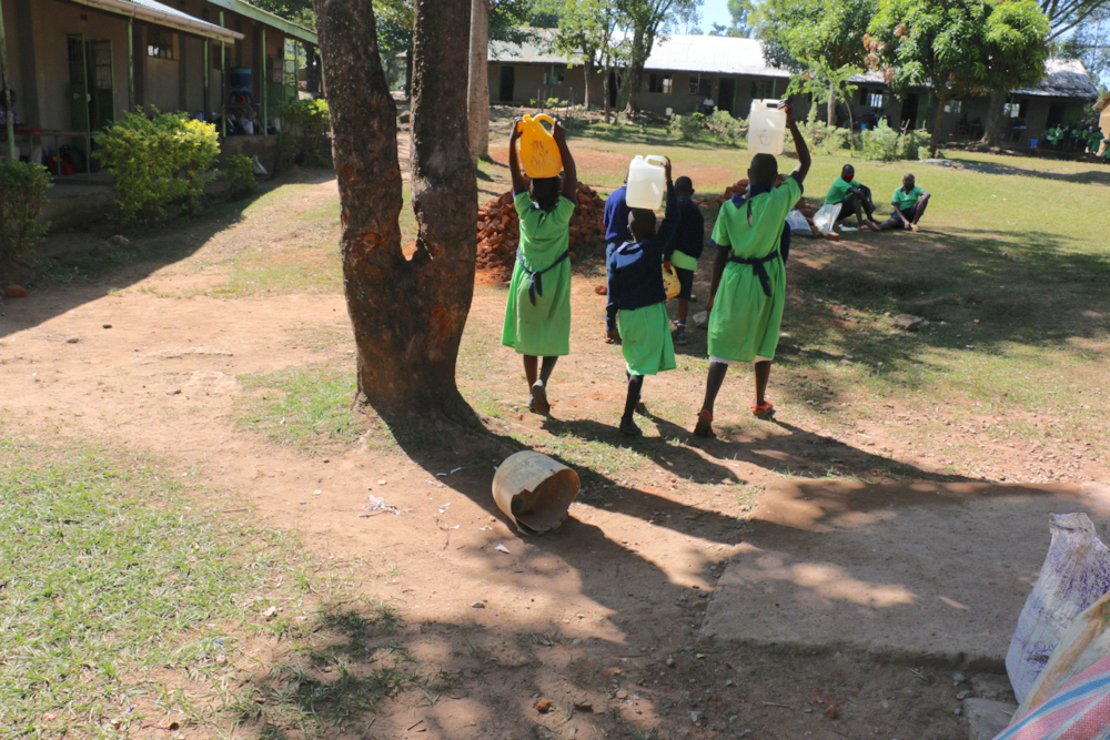 The Water Project : kenya21360-students-carrying-water-1