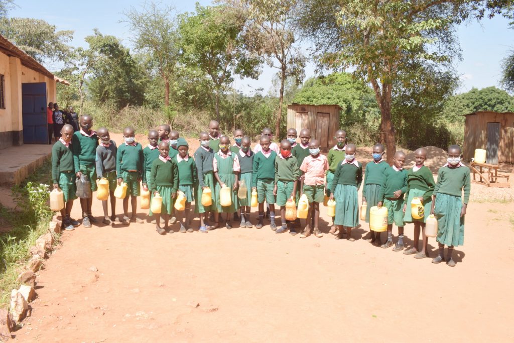 The Water Project : kenya21470-students-hold-water-containers-2