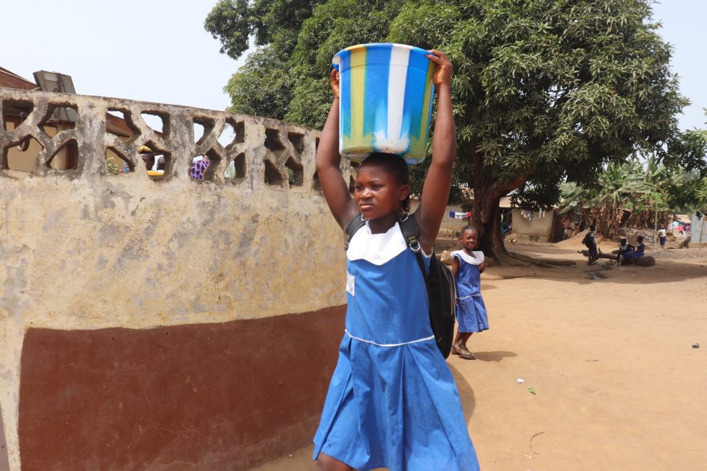 The Water Project : sierraleone21538-student-carrying-water-1