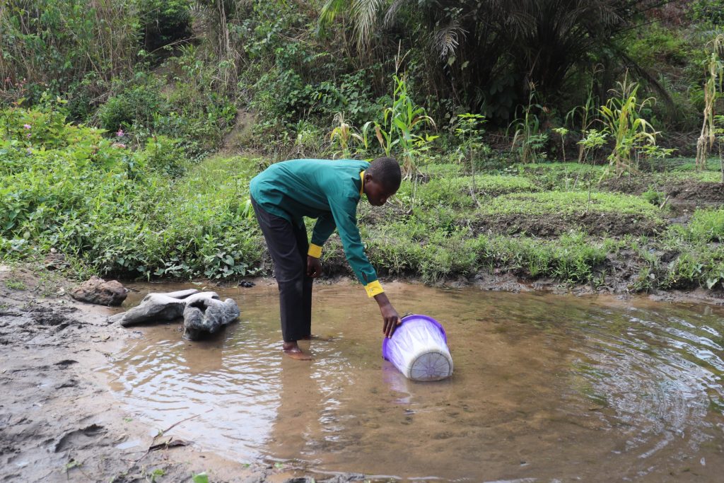 The Water Project : sierraleone21544-student-collecting-water-at-alternate-source-2