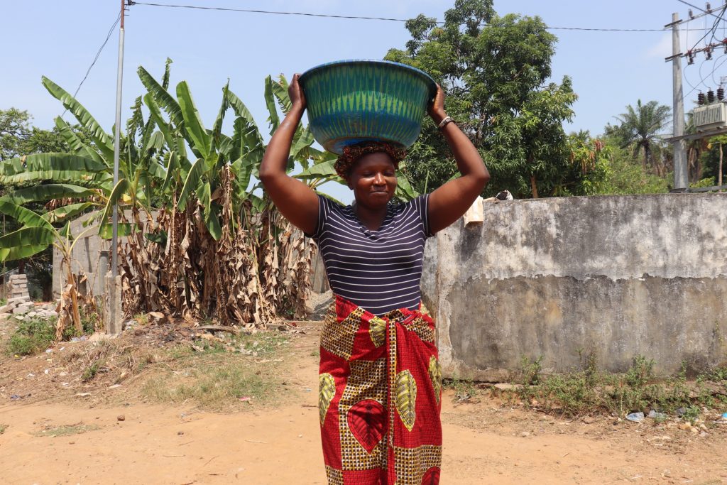The Water Project : sierraleone21543-woman-carrying-water-4