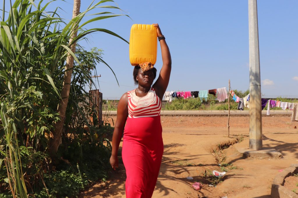 The Water Project : sierraleone21563-young-girl-carrying-water-2