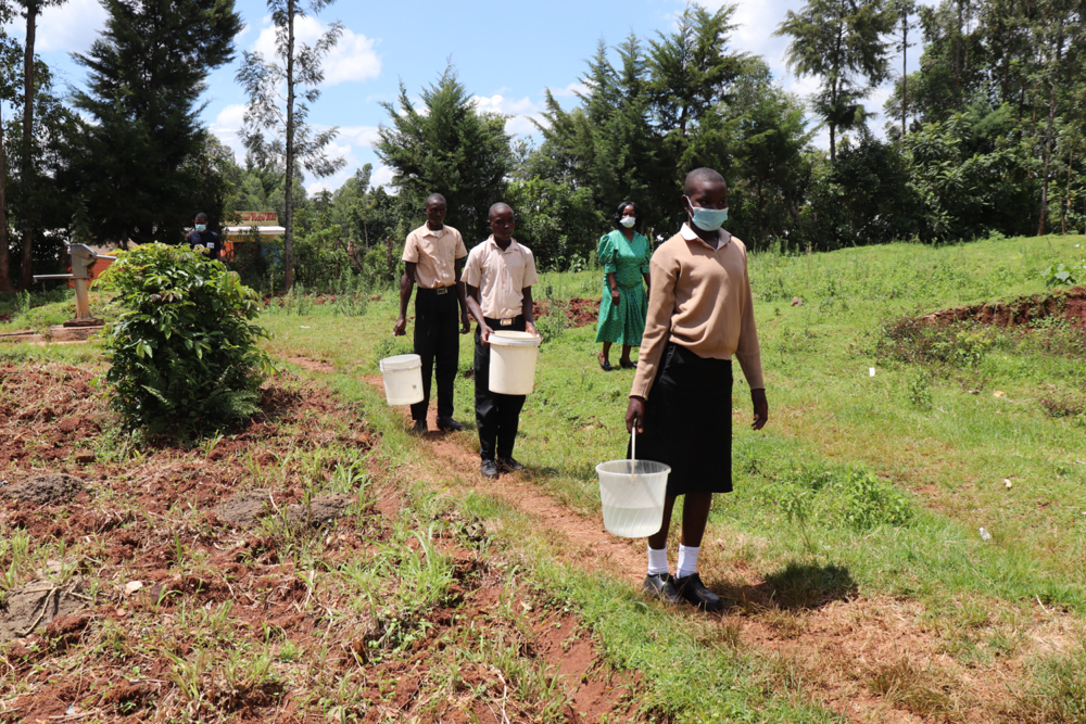 The Water Project : kenya21260-students-carry-water-from-the-well