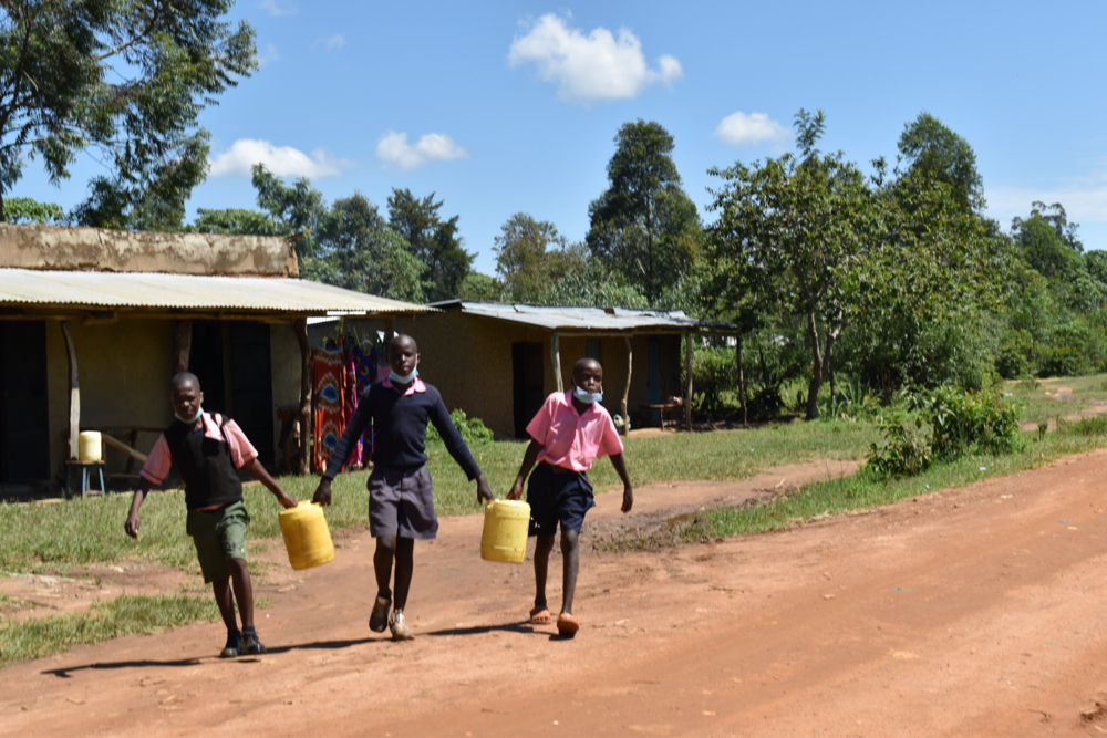 The Water Project : kenya21264-students-coming-from-the-water-source-3