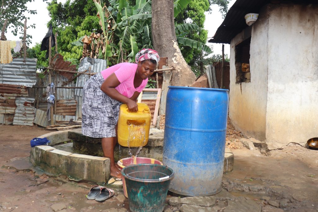 The Water Project : sierraleone21553-woman-collecting-water-2